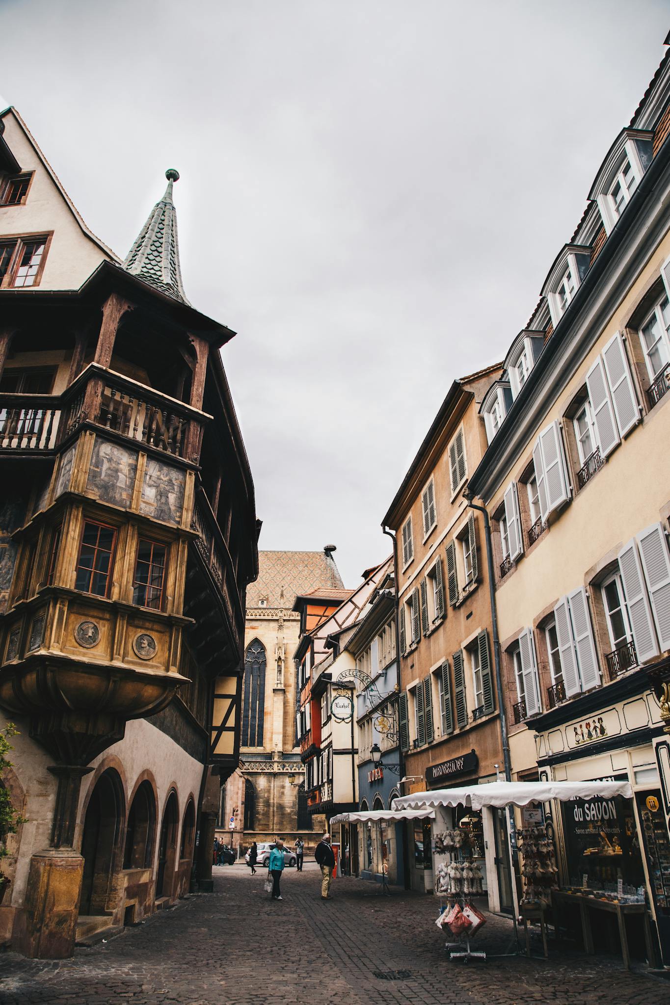Explore the enchanting medieval architecture and vibrant street life of Colmar, France.